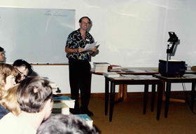 A Library staff member presenting a reader education class using print based resources, 1980s.