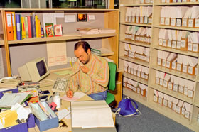 A Library staff member processing inter-library loans, c 1992.