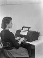 Ina Kirby operating a teleprinter, 1949