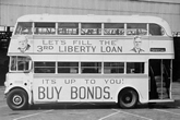 Bus depicting Curtin and Churchill - 'Let's fill the 3rd Liberty Loan'. JCPML00376/130