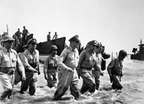 General Douglas MacArthur wading ashore in the Philippines, 1944.