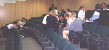 Students discussing planning the role play