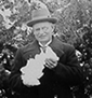 John Curtin holding a lump of snow, Canberra, Sept 1929. JCPML00450/2.