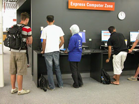 Express computers on level two with a Library rover assisting clients, 2008