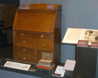 John Curtin's desk. Four Freedoms book presented to Curtin by President Roosevelt in 1944. Silver box and facsimile of the illustrated address conferring the Freedom of the City of London on PM Curtin, 1944.