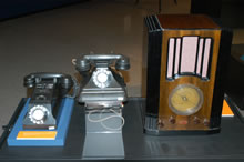 Telephone similar to one used in Prime Minister John Curtin's office c. 1940s; Telephone similar to one installed in Prime Minister John Curtin's Cottesloe home 1940s; and Airzone wireless capable of picking up short wave broadcasts, c.1935. 
