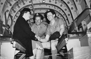John Curtin Prime Ministerial Library.  Records of Don Delaney.  Mrs Curtin on board Lancaster bomber "Queenie VI" with Flt Lt Peter Isaacson and Pilot officer Don Delaney, Canberra, 21 October 1943.  JCPML00385/2