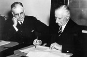 PM John Curtin watching Lord Gowrie signing declaration of war on Japan, December 1941. JCPML00449/5