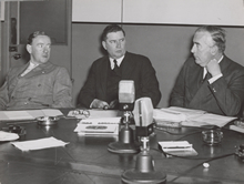 Minister for the Army, Percy Spender, Arthur Fadden and Robert Menzies at an emergency meeting to discuss the Japanese crisis. Original held by the State Library of Victoria, image no. H99.201/2592.