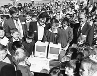 Curtin University Library. Carmen Lawrence Collection. Records of Carmen Lawrence. Carmen Lawrence presenting the 100th Apple computer to Kinlock Primary School, winners of the Coles Apples for Students competition, 13 August 1991. CUL00005/3/42