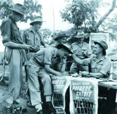 Soldiers buying war bonds to support the war effort