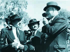 John Curtin talking with servicewomen, 1943