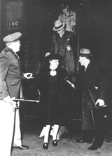 Elsie Curtin alighting from US train helped by Frederick McLaughlin and US aide, Curtin behind., 1944. Records of Frederick McLaughlin. JCPML00018/1. 