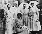 An undated photograph of Marie with a group of nurses at the Mothers' Clinic