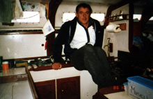 Jon Sanders in the cabin kitchen area of the Parry Endeavour. At sea, 9 August to 29 Sepember 1986. CUL00039/19/1.