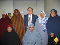Curtin University Library. Geoff Gallop Collection. Records of Geoff Gallop. Geoff Gallop with a group of Somali women migrants, 2004. GG00020/51